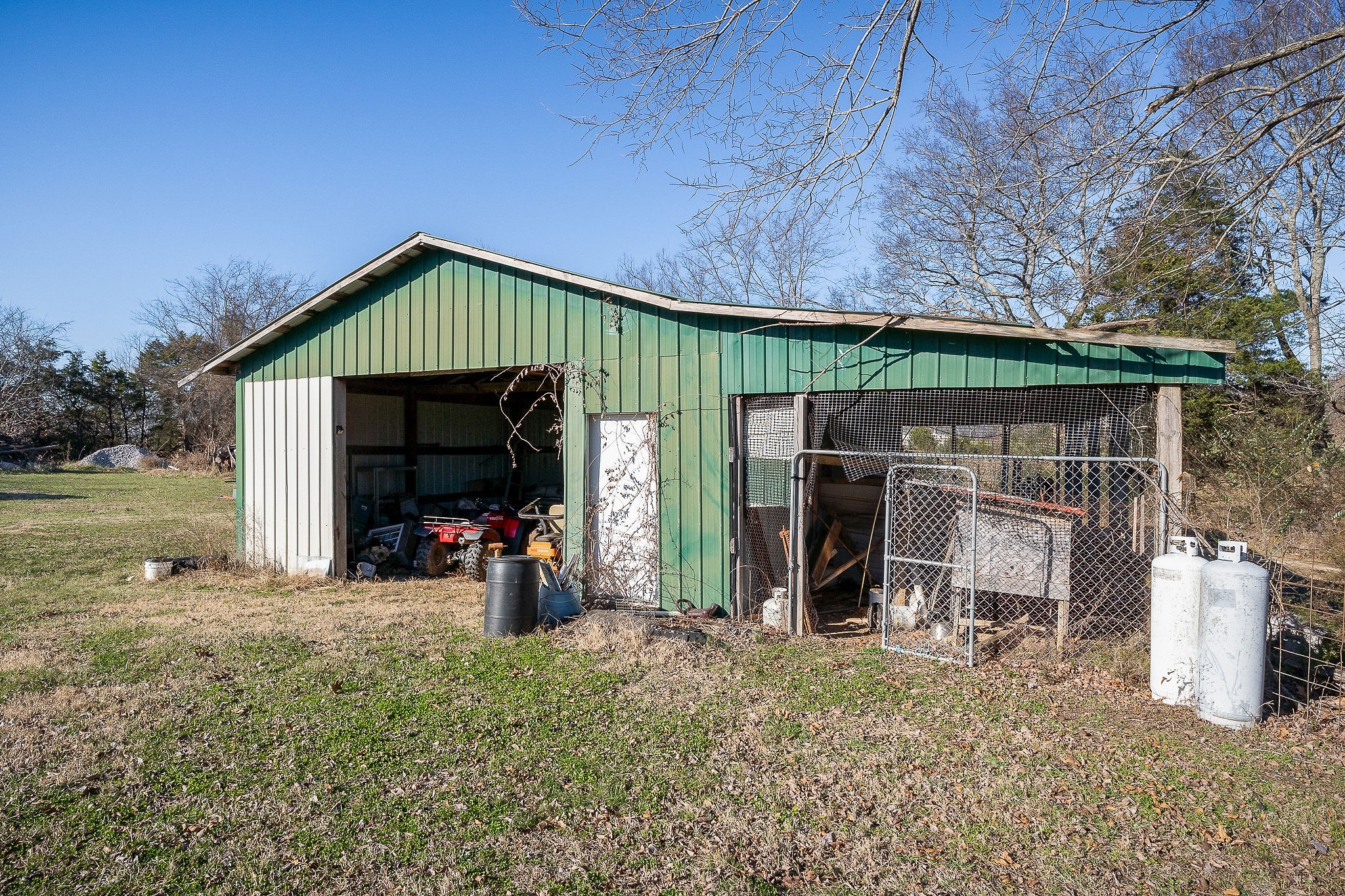505 Thaxton Road McMinnville, TN 37110 - Photo 26 of 31 a view of a small house with wooden fence