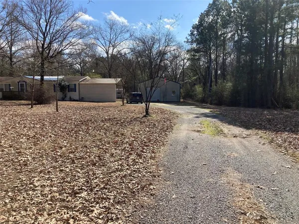 a house with trees in the background