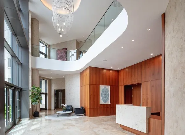 a view of a hallway with entryway and windows