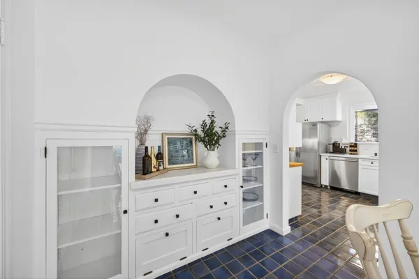 a view of a dining room with furniture and window