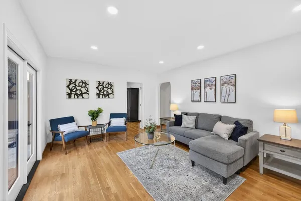 a living room with furniture and a rug