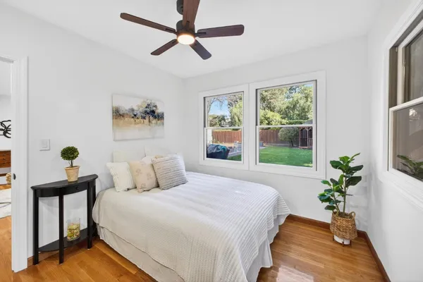 a bedroom with a bed and window