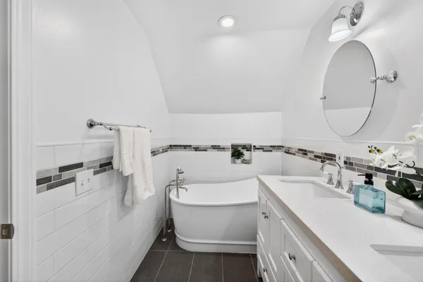 a bedroom with a bed and a table in it