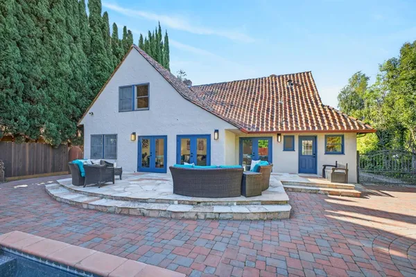 a view of a backyard with large trees