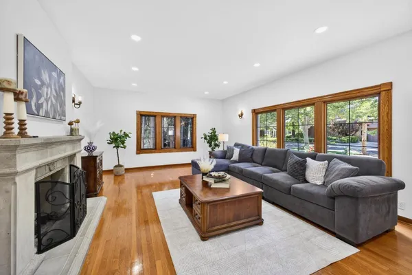 a living room with furniture and a fireplace