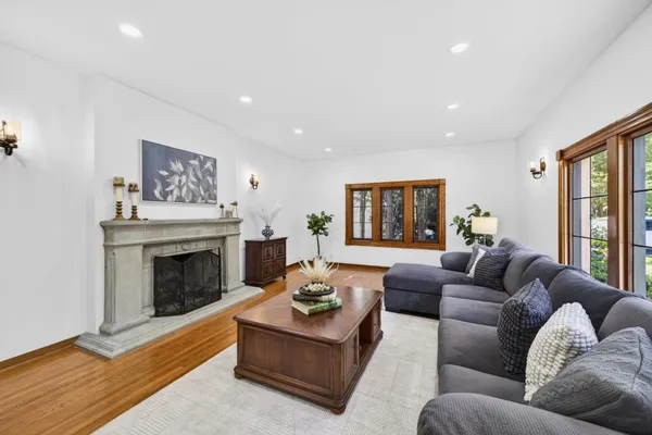 a living room with furniture and a fireplace