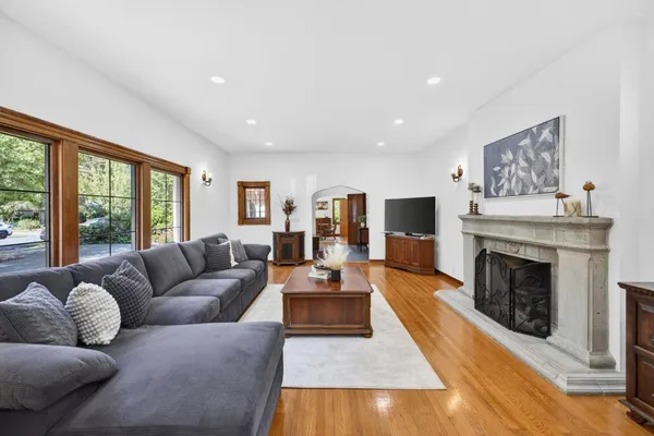 a living room with furniture fireplace and flat screen tv