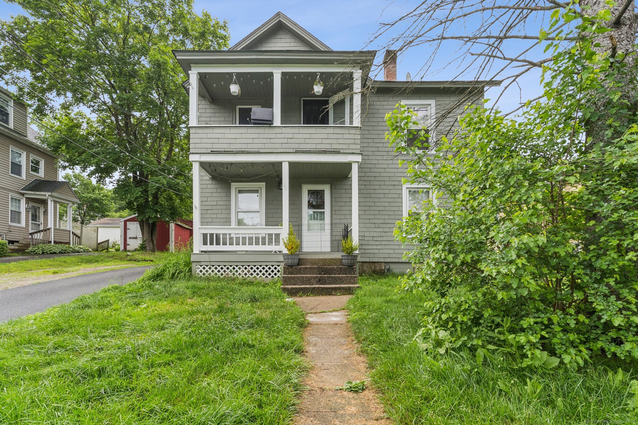 a front view of a house with garden