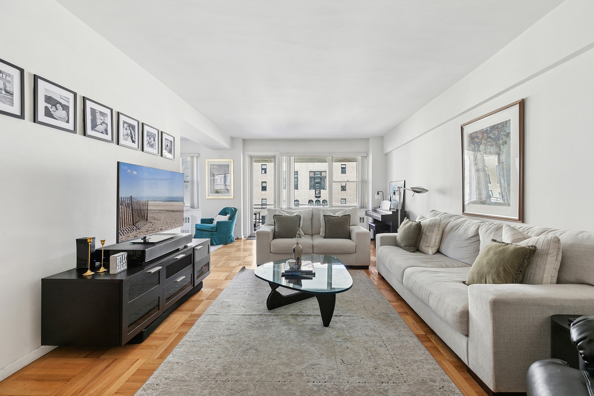 a living room with furniture and a flat screen tv