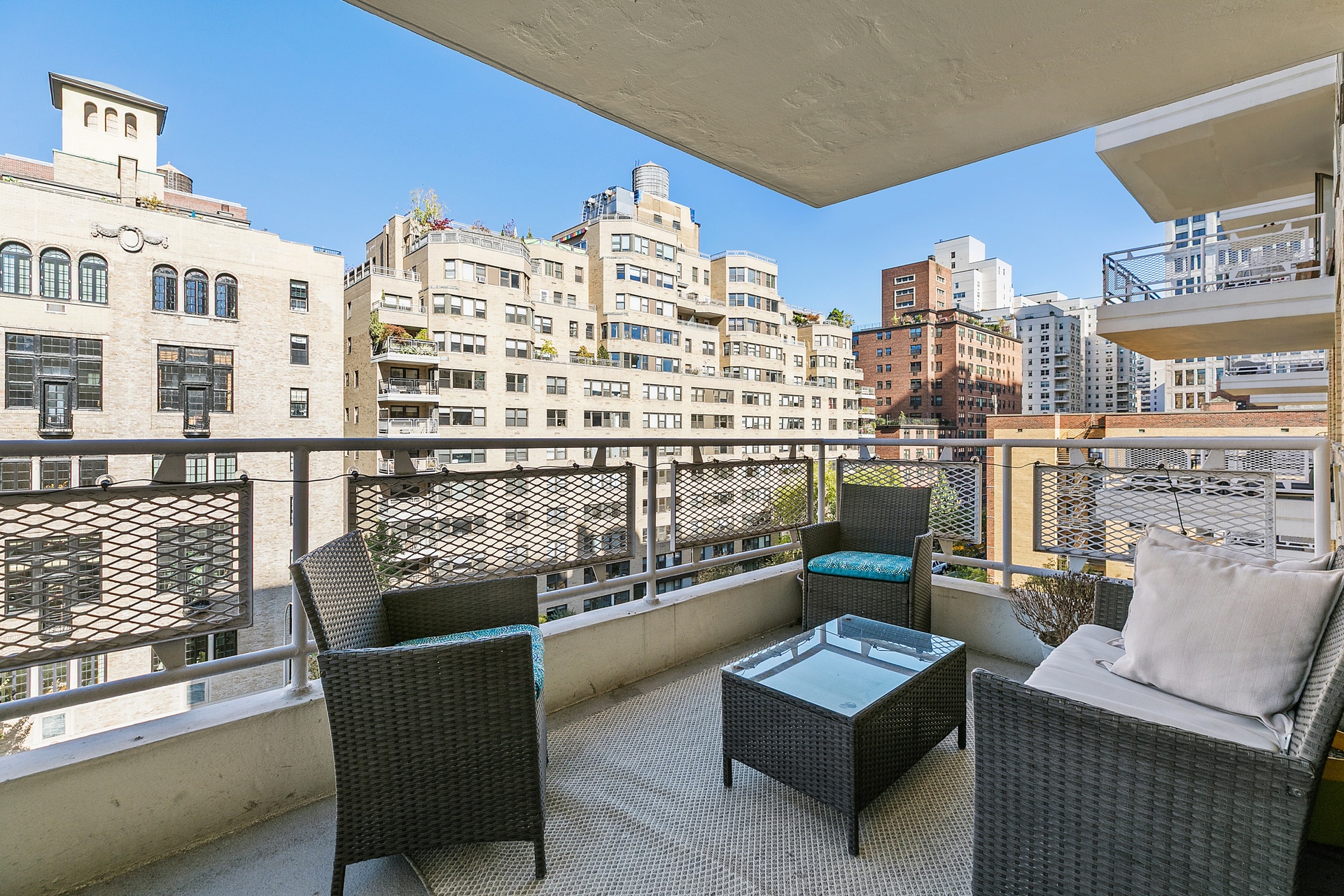 40 East 9th Street, Unit 7D Manhattan, NY 10003 - Photo 10 of 14 a view of a balcony with chairs and a potted plant