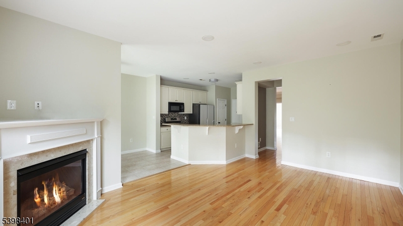 18 Truman Avenue Princeton, NJ 08540 - Photo 16 of 29 a view of a kitchen with a sink a fireplace and wooden floor