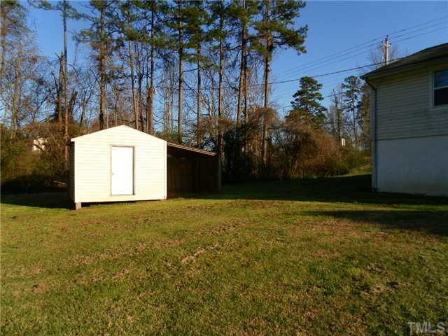 136 Cavel Chub Lake Road Roxboro, NC 27574 - Photo 3 of 11 a backyard of a house with lots of green space