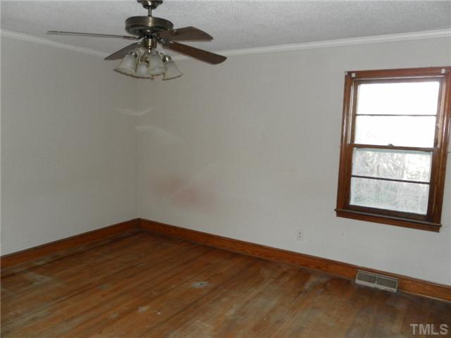 136 Cavel Chub Lake Road Roxboro, NC 27574 - Photo 8 of 11 an empty room with a window