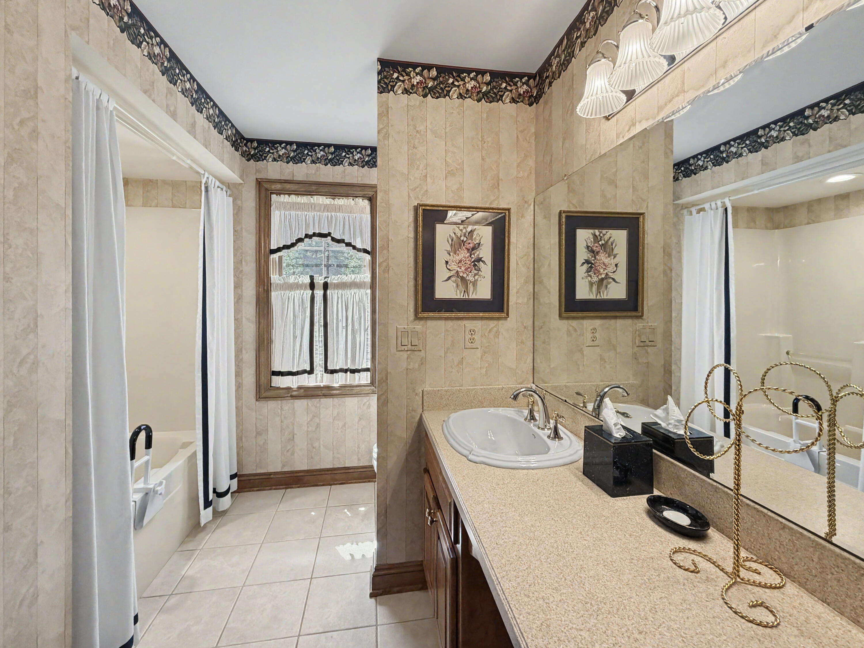 W291-s5245 Ridgefield Road Waukesha, WI 53189 - Photo 26 of 44 Well-appointed full bath with oversized vanity, generous storage, tub/shower combination, and bright natural light