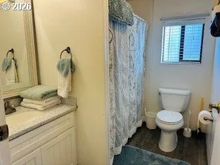 a bedroom with furniture and a window