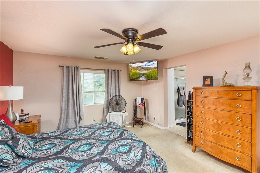28984 Escalante Road Menifee, CA 92587 - Photo 17 of 40 Primary bedroom with entrance to the bathroom suite