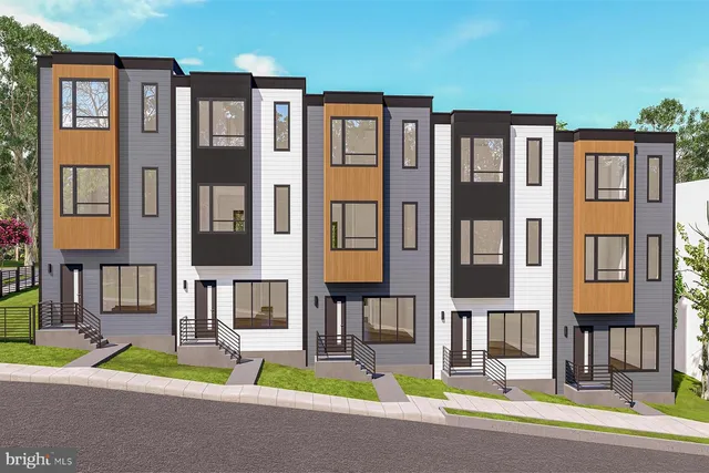 a view of a brick building next to a yard