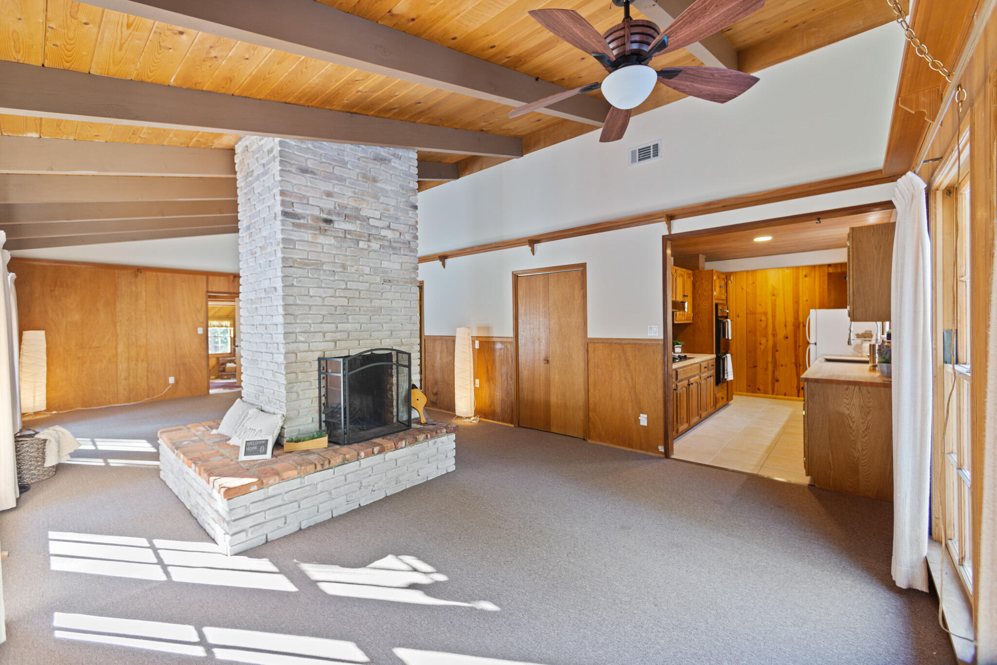 25465 Seneca Road Idyllwild, CA 92549 - Photo 12 of 38 a living room with furniture and a fireplace