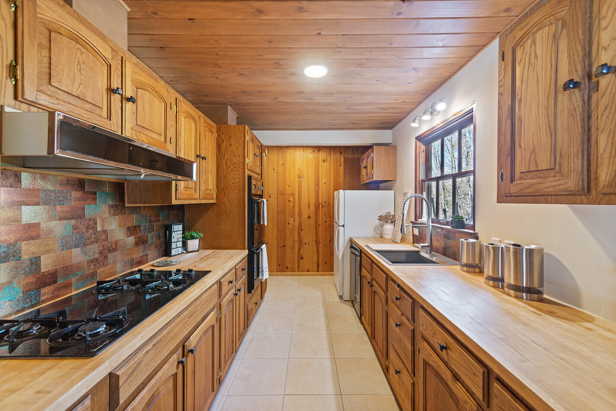 25465 Seneca Road Idyllwild, CA 92549 - Photo 8 of 38 a kitchen with stainless steel appliances a sink stove and cabinets