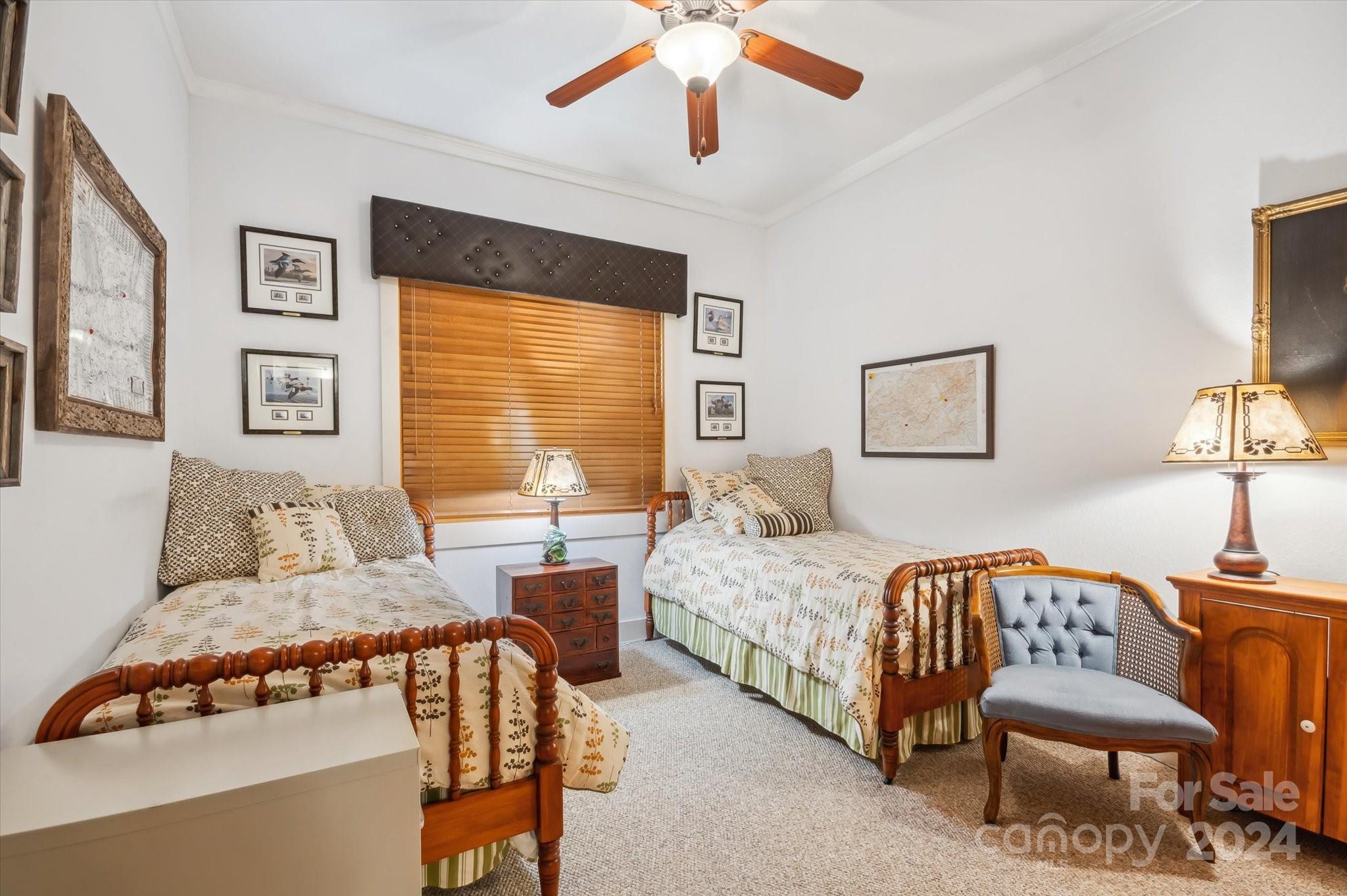 39 Elms Rest Cullowhee, NC 28723 - Photo 22 of 45 a bedroom with two beds and a chandelier