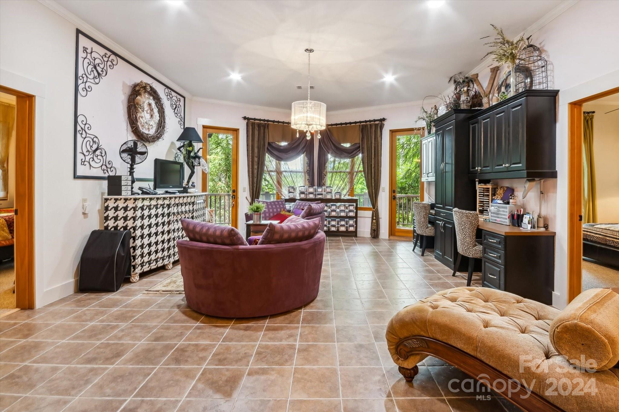 39 Elms Rest Cullowhee, NC 28723 - Photo 26 of 45 a living room with furniture a large window and a dining table