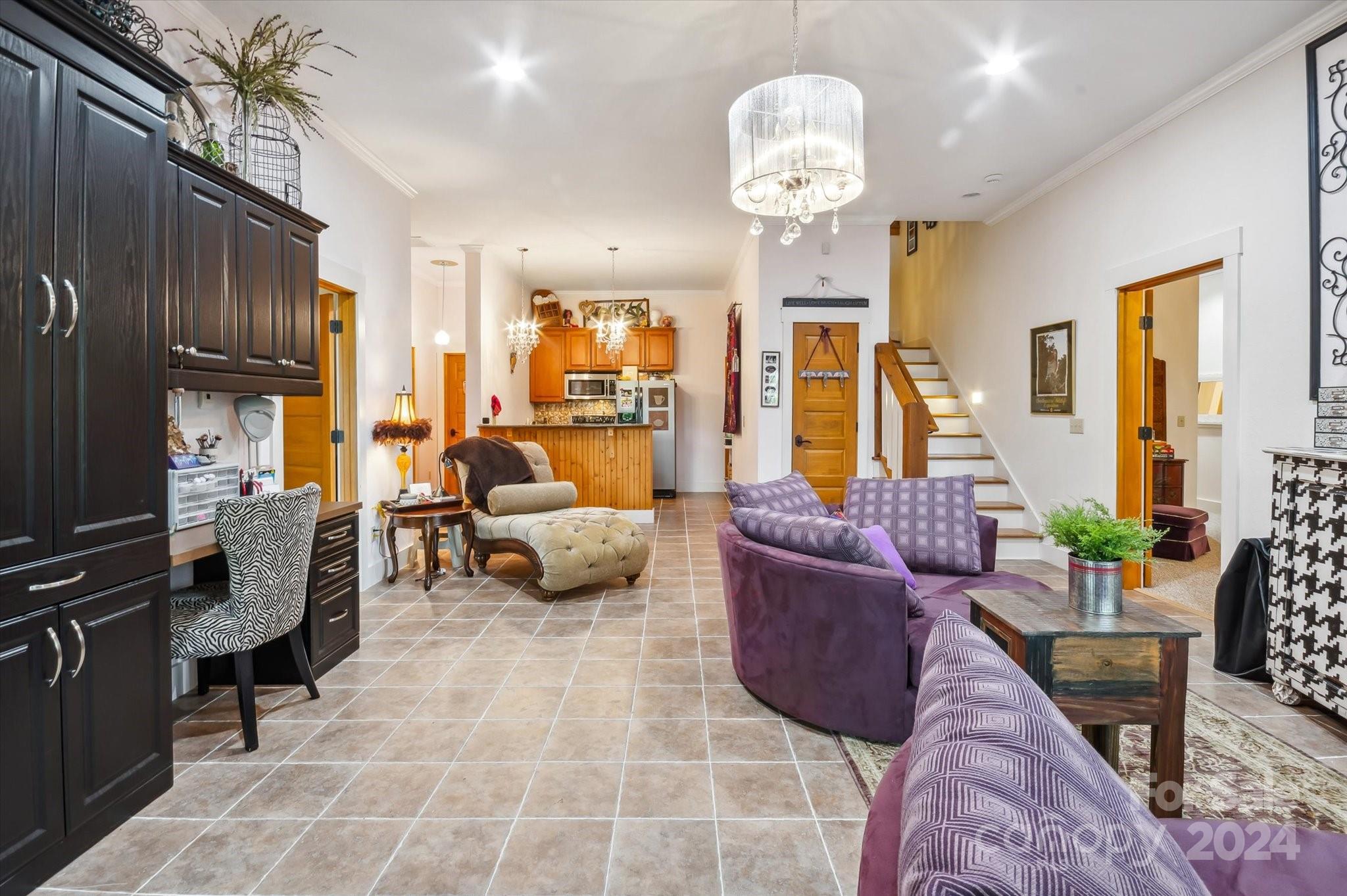 39 Elms Rest Cullowhee, NC 28723 - Photo 27 of 45 a living room with furniture fireplace and a chandelier