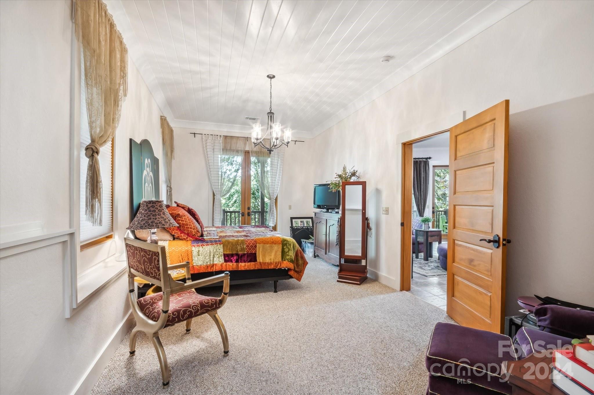 39 Elms Rest Cullowhee, NC 28723 - Photo 33 of 45 a living room with furniture a chandelier and a window