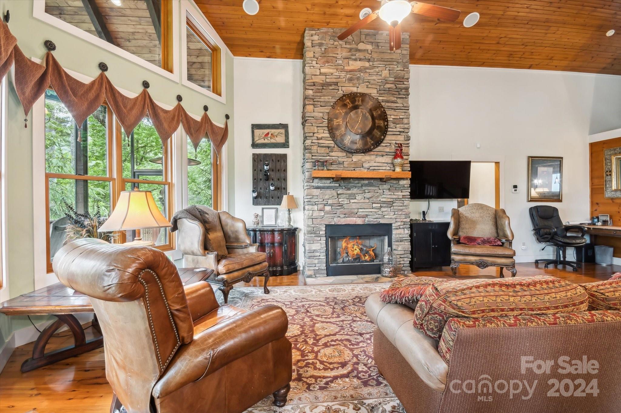 39 Elms Rest Cullowhee, NC 28723 - Photo 5 of 45 a living room with furniture a large window and a fireplace