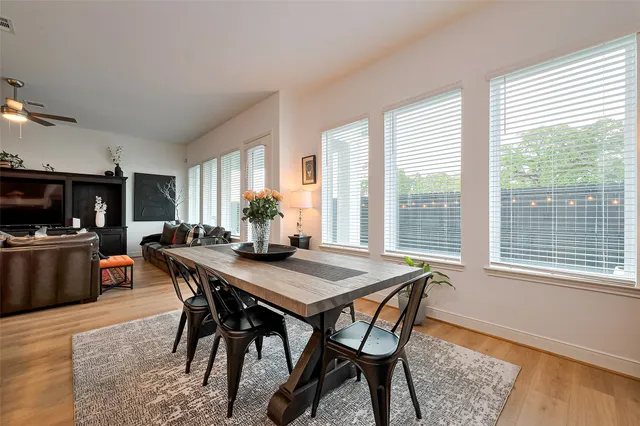a view of a dining room with furniture and window