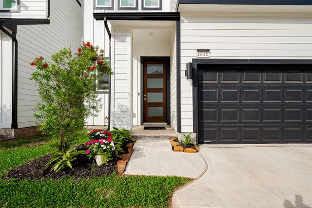a front view of a house with a garage