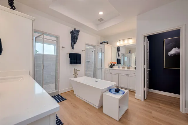a bathroom with a sink a mirror and shower