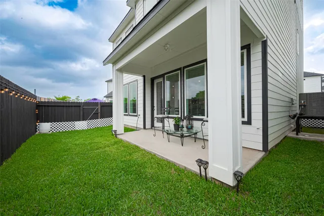 a view of a backyard with sitting area