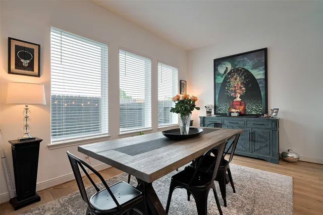 a dining room with furniture and window