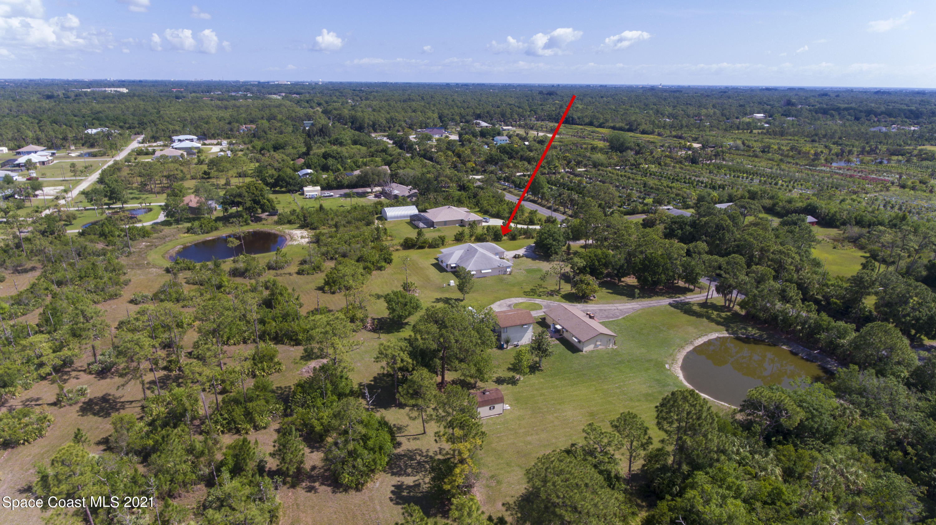 2770 Weber Road Malabar, FL 32950 - Photo 22 of 23 an aerial view of residential houses with outdoor space and trees