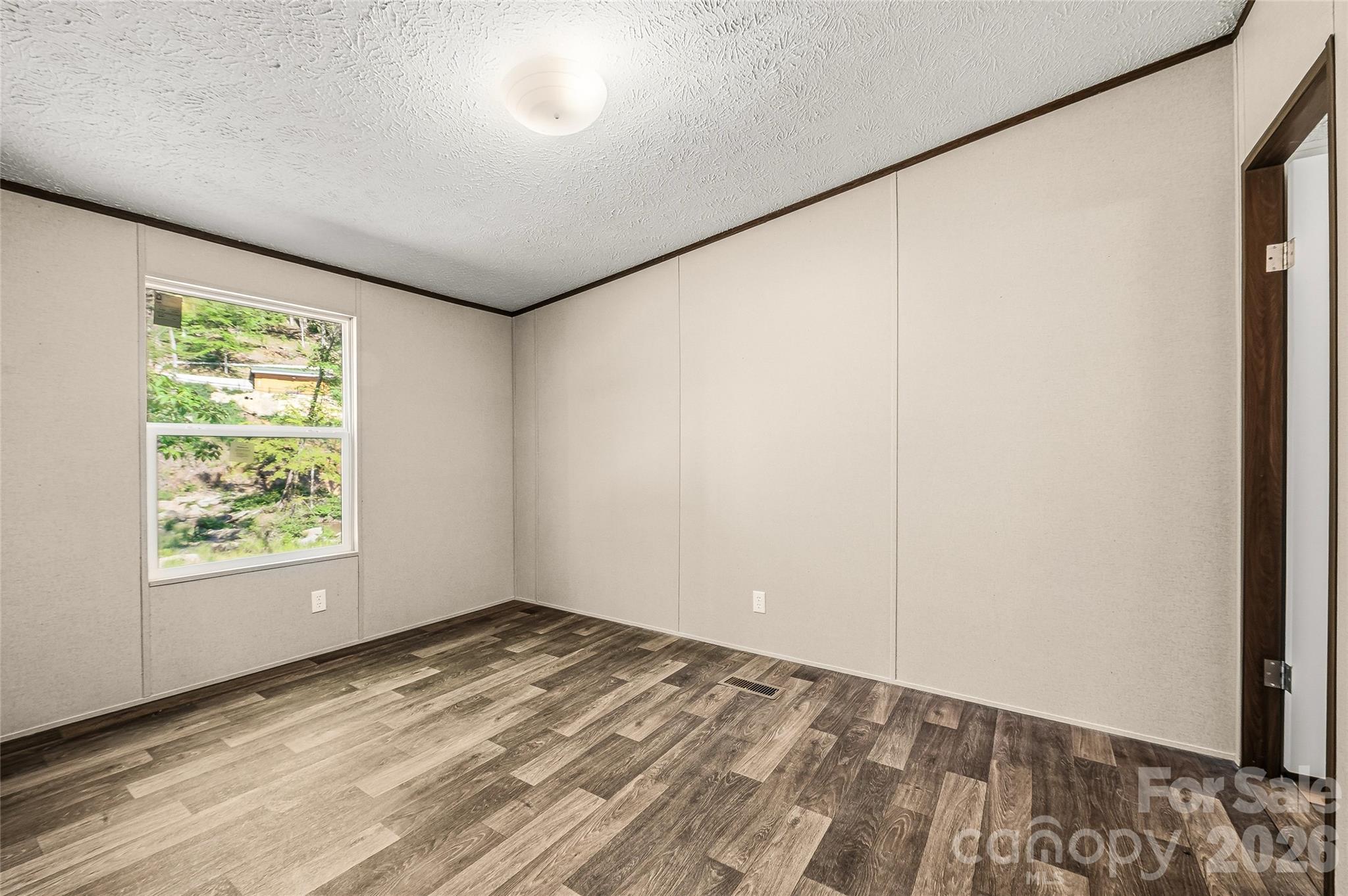 45 Alan Retreat Road Hendersonville, NC 28792 - Photo 21 of 25 an empty room with windows