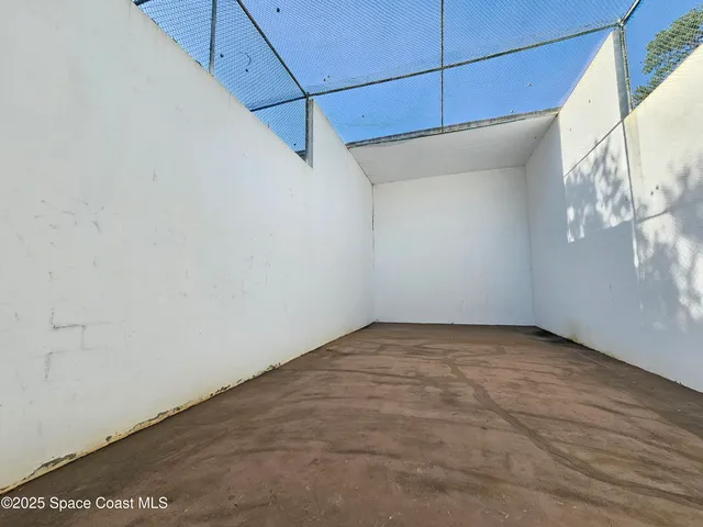 a view of an outdoor space and tennis court