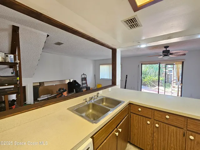 a kitchen with a refrigerator and a stove