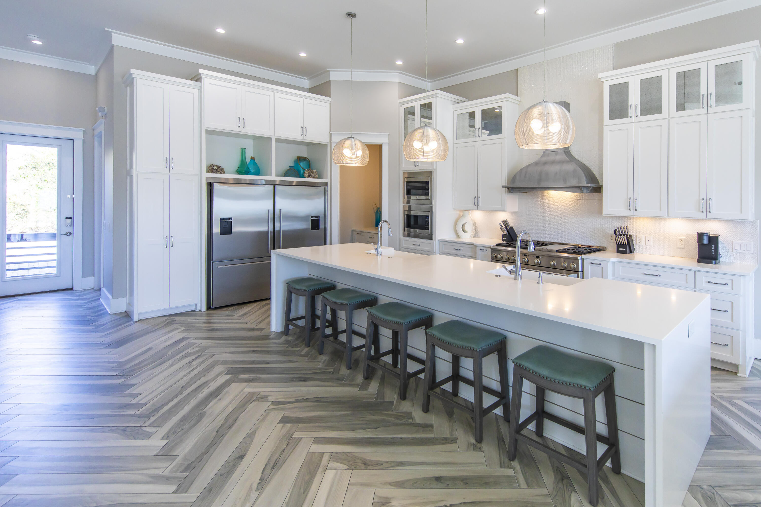 8947 East County Highway 30A Inlet Beach, FL 32461 - Photo 18 of 69 a kitchen with stainless steel appliances a dining table chairs and stove