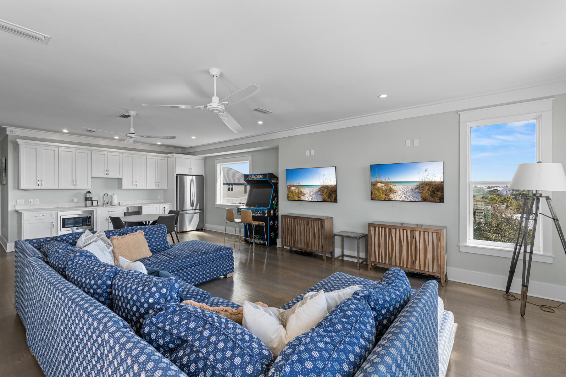 8947 East County Highway 30A Inlet Beach, FL 32461 - Photo 19 of 55 a living room with furniture a large window and wooden floor