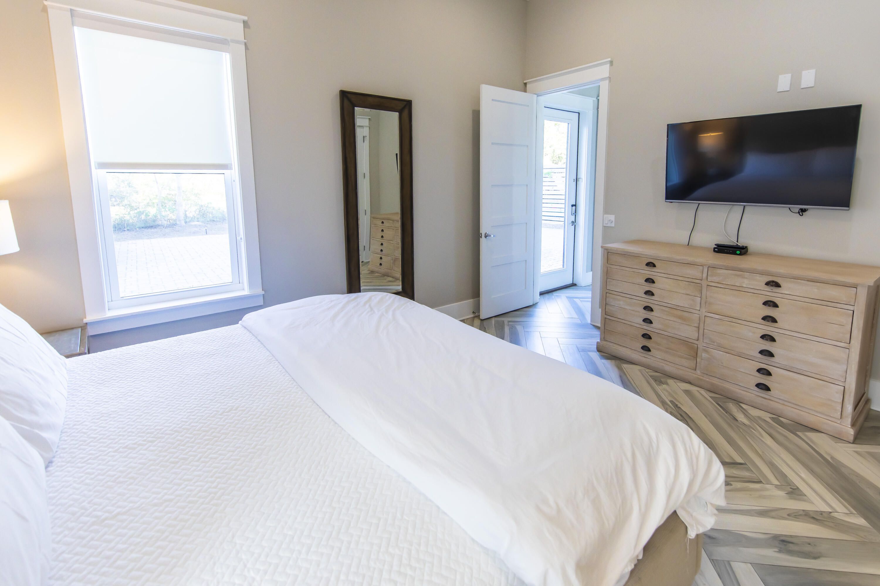 8947 East County Highway 30A Inlet Beach, FL 32461 - Photo 25 of 69 a large white bed in a flat screen tv and a dresser