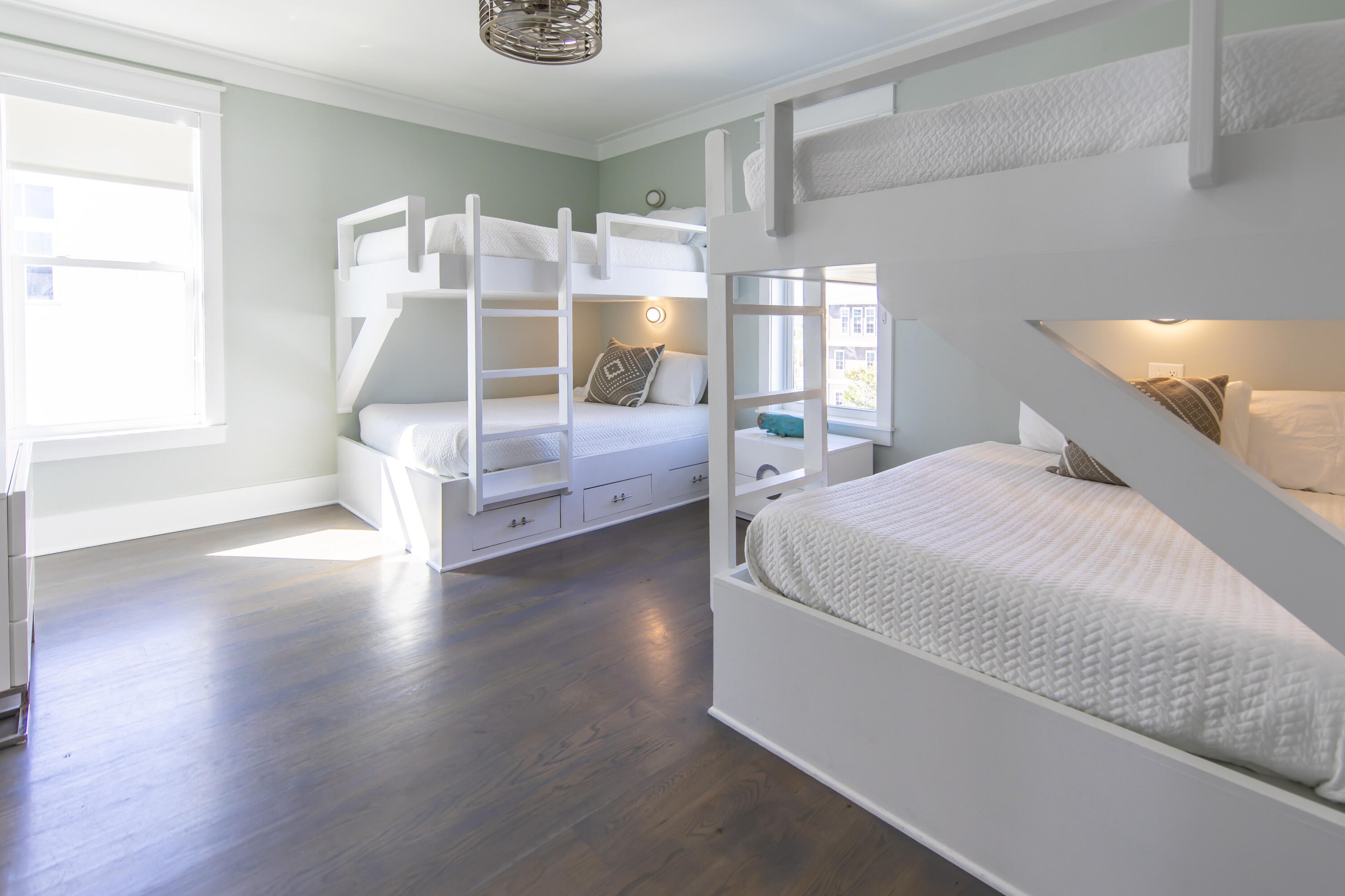 8947 East County Highway 30A Inlet Beach, FL 32461 - Photo 32 of 69 a bedroom with a bed and wooden floor