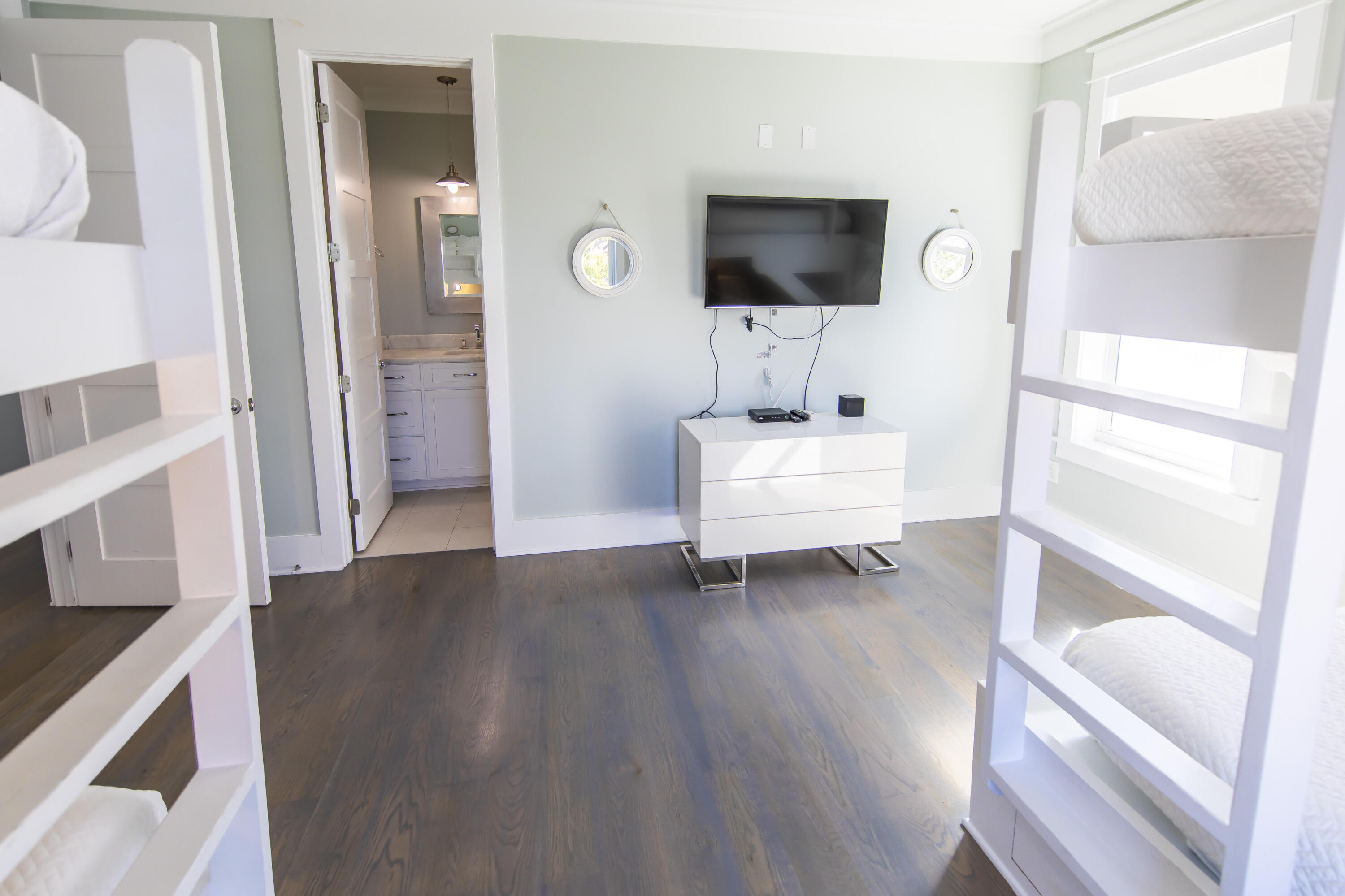 8947 East County Highway 30A Inlet Beach, FL 32461 - Photo 34 of 69 a living room with furniture and a flat screen tv