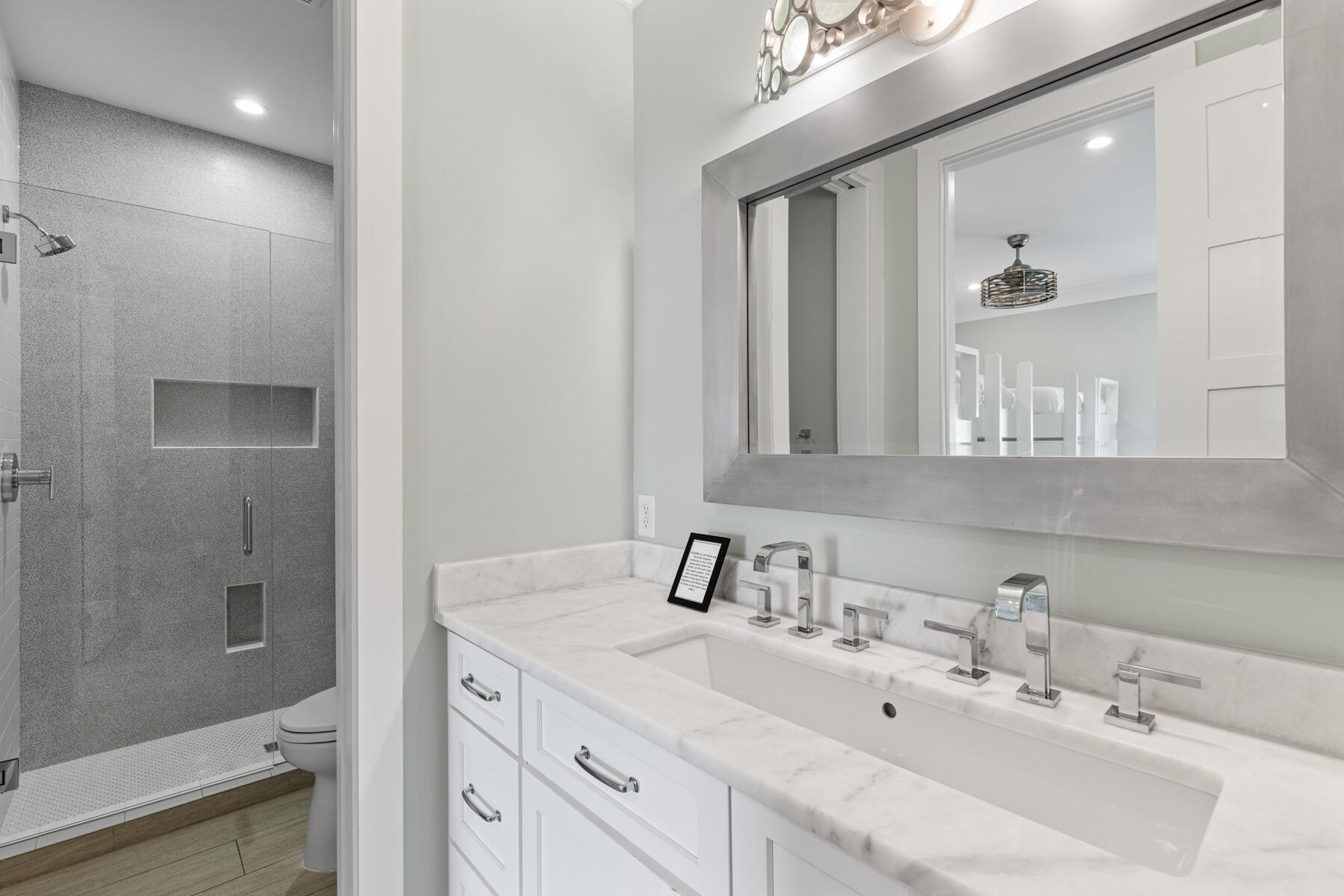 8947 East County Highway 30A Inlet Beach, FL 32461 - Photo 35 of 55 a bathroom with a sink and a mirror