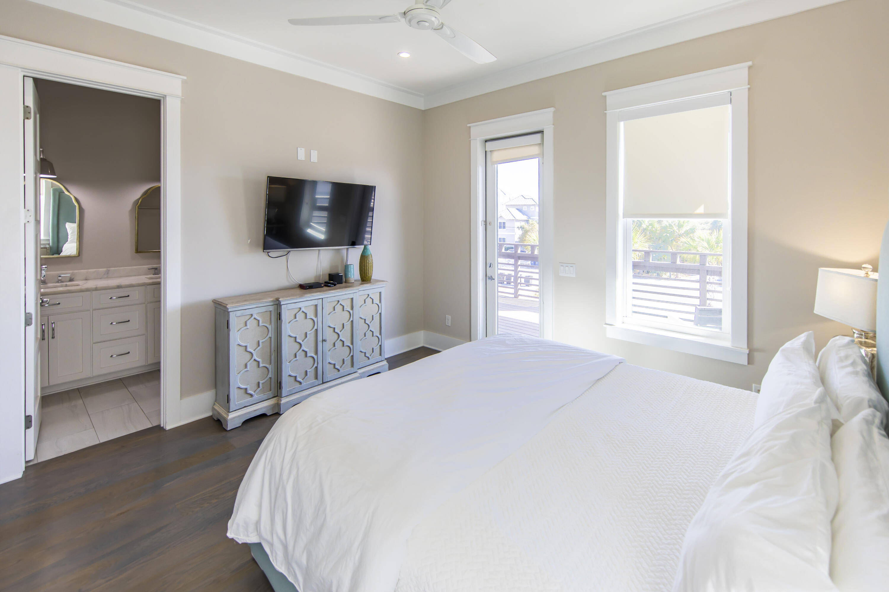 8947 East County Highway 30A Inlet Beach, FL 32461 - Photo 39 of 69 a bedroom with a bed and a flat screen tv