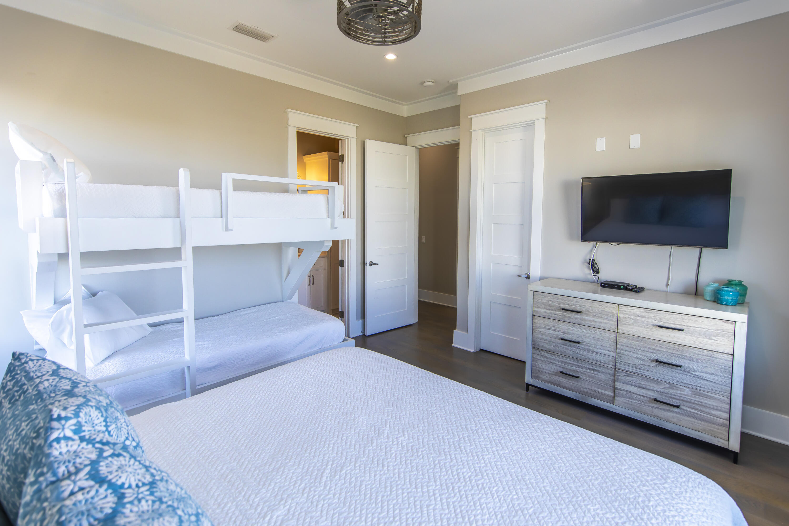 8947 East County Highway 30A Inlet Beach, FL 32461 - Photo 50 of 69 a bedroom with a bed and flat screen tv