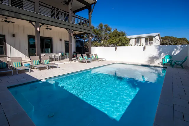 an aerial view of a house with outdoor space