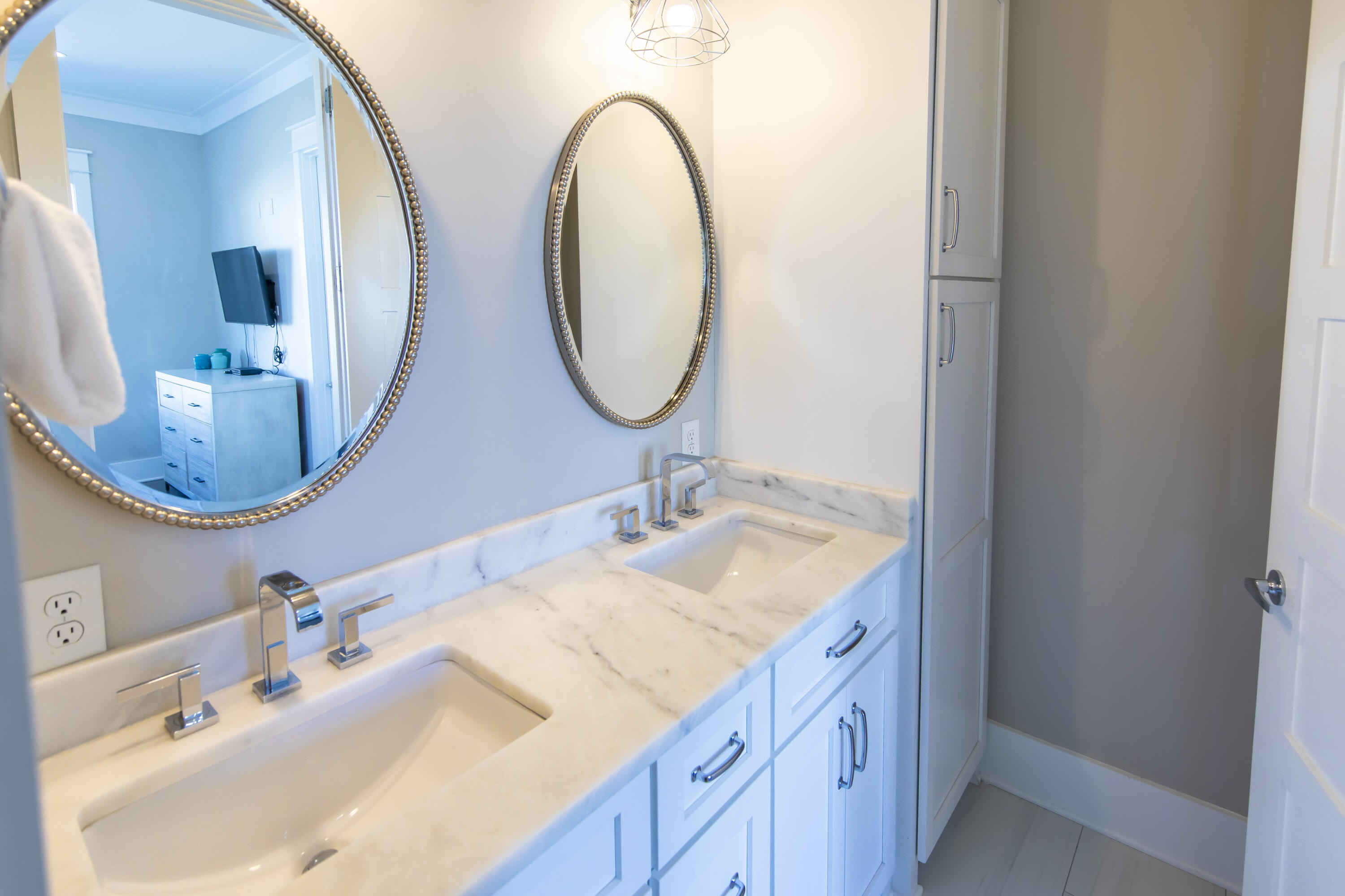 8947 East County Highway 30A Inlet Beach, FL 32461 - Photo 51 of 69 a bathroom with a double vanity sink and a mirror