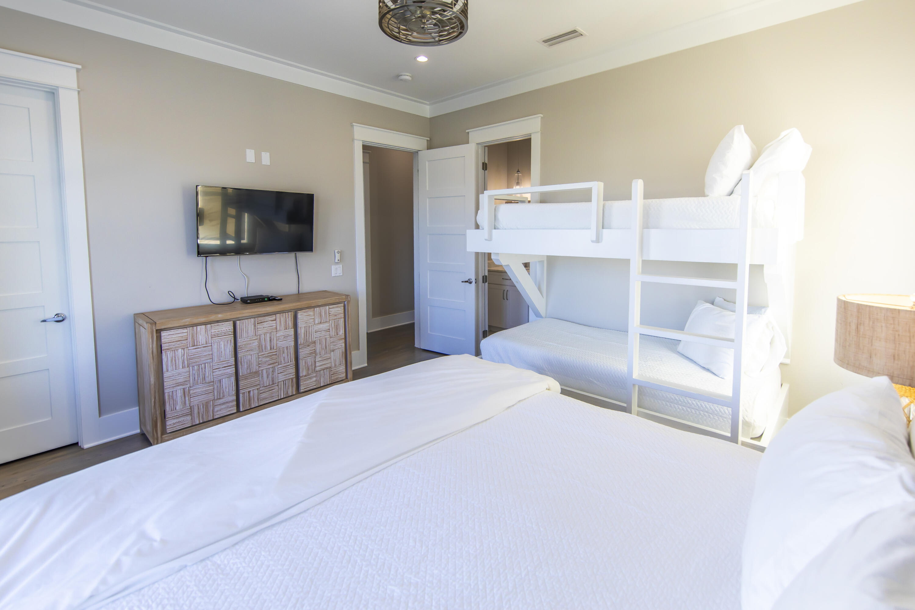 8947 East County Highway 30A Inlet Beach, FL 32461 - Photo 54 of 69 a room with a bed and a television in it