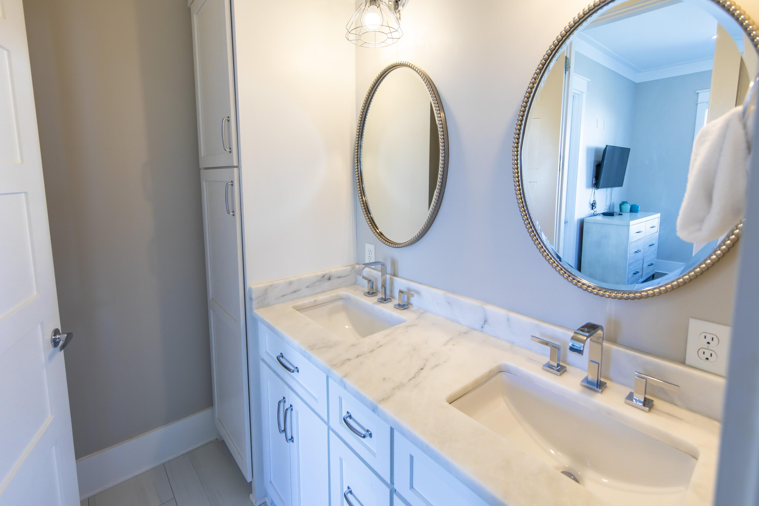 8947 East County Highway 30A Inlet Beach, FL 32461 - Photo 55 of 69 a bathroom with 2 sink and a mirror
