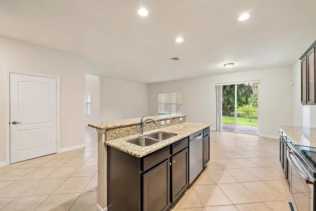 a kitchen with a sink and a window
